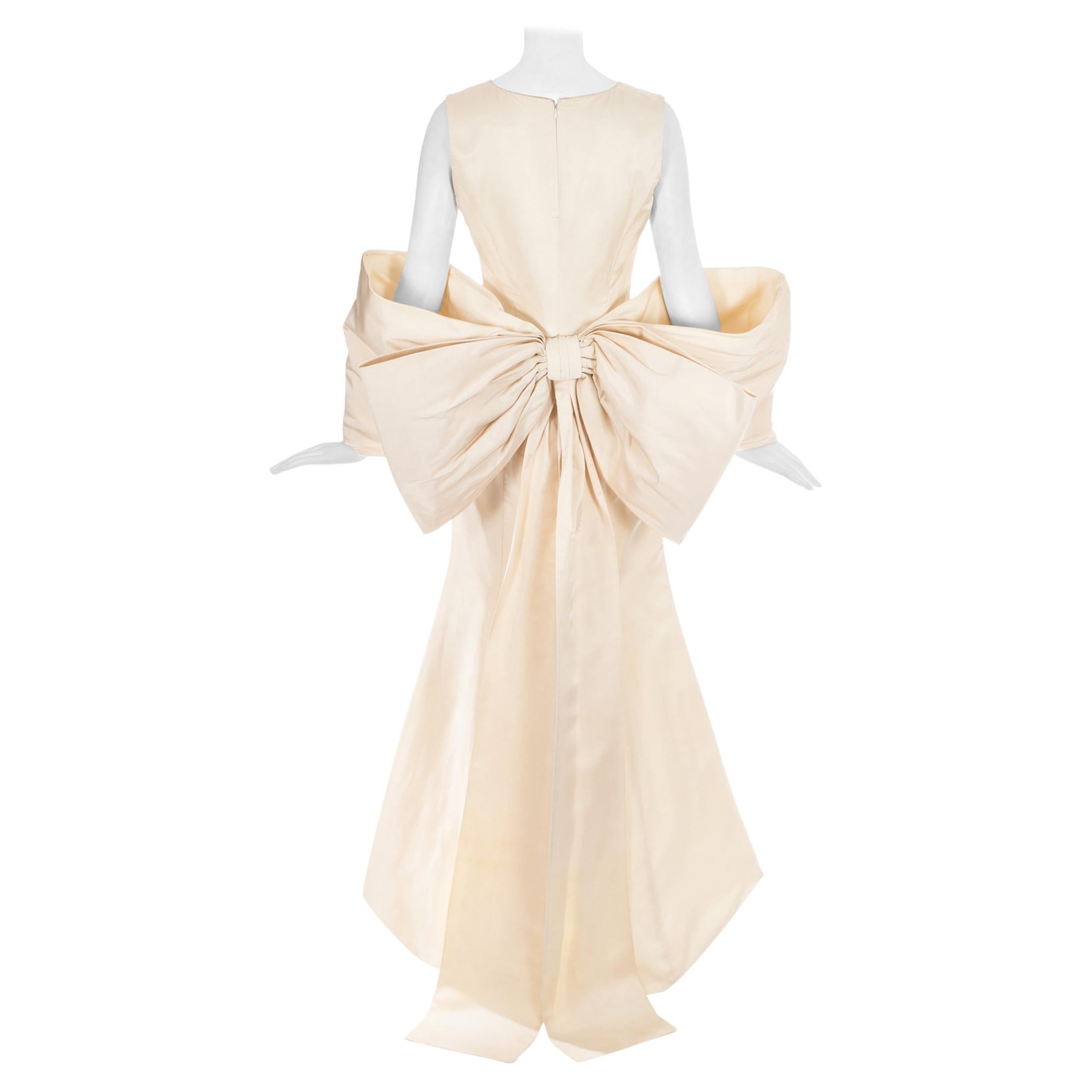 Dolce & Gabbana ivory silk fishtail wedding dress with large bow, c. 1990s For Sale