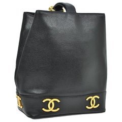 Vintage Chanel Black Leather Gold Charms Sling Back Carryall Duffle Shoulder Bag