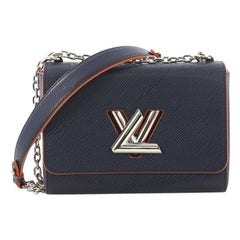 Louis Vuitton Twist Handbag Epi Leather MM, crafted from navy epi leather