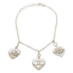 Chanel CC Aged Gold Tone Metal Motif Embedded Resin Heart Pendants Necklace