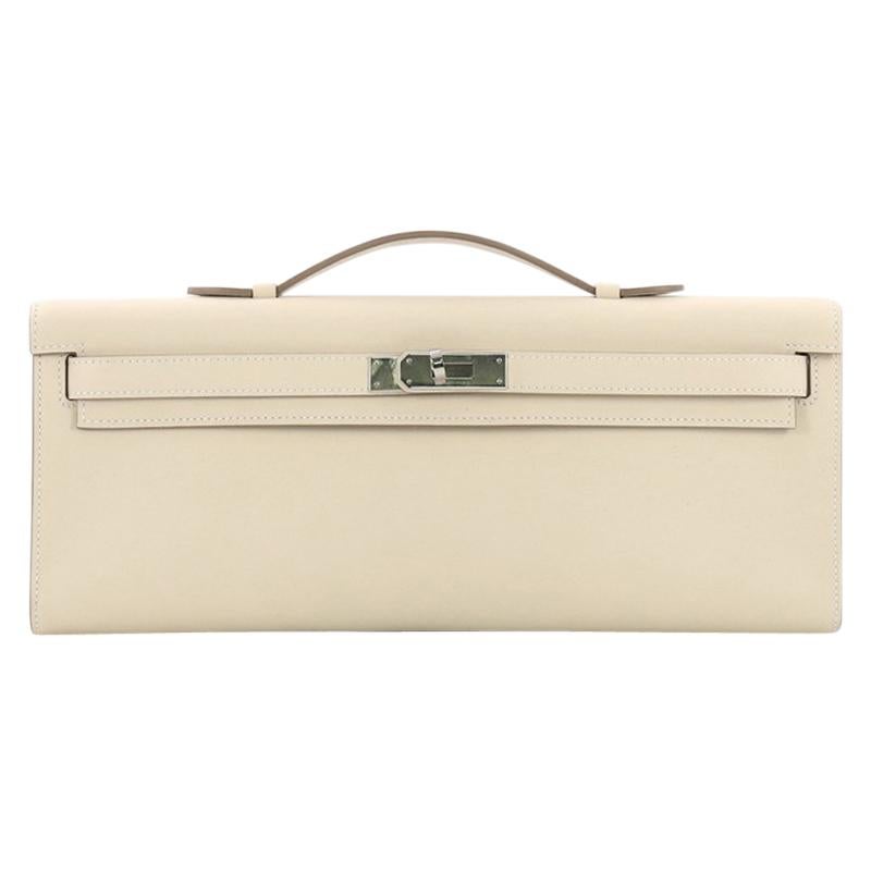 Hermes Kelly Cut Pochette Swift, crafted in Craie cream Swift leather