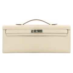 Hermes Kelly Cut Pochette Swift, crafted in Craie cream Swift leather