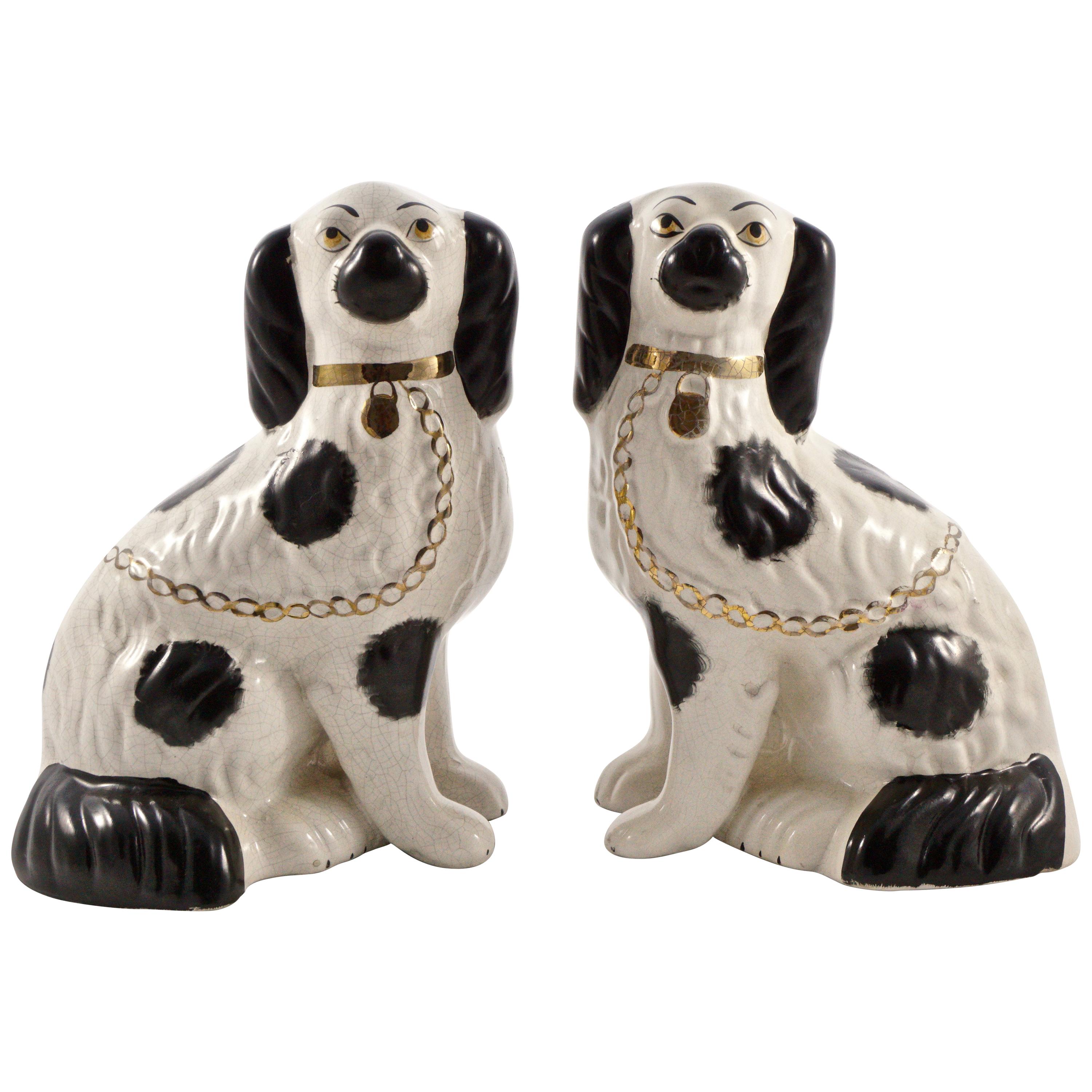 Pair of Staffordshire Hand Painted Black and White Pottery Dog Figurines