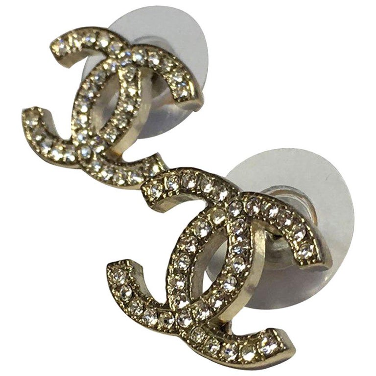 CHANEL CC Stud Earrings in Pale Gilded Metal set with White