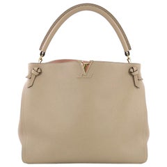 Louis Vuitton Tournon Handbag Leather