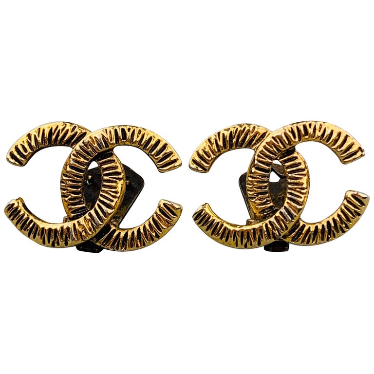 CHANEL VINTAGE 1950's Antique Gold Tone CC Clip On Earrings at 1stDibs
