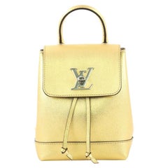 Vuitton Sold Out New Gold Lockme Mini Backpack For Sale at 1stDibs