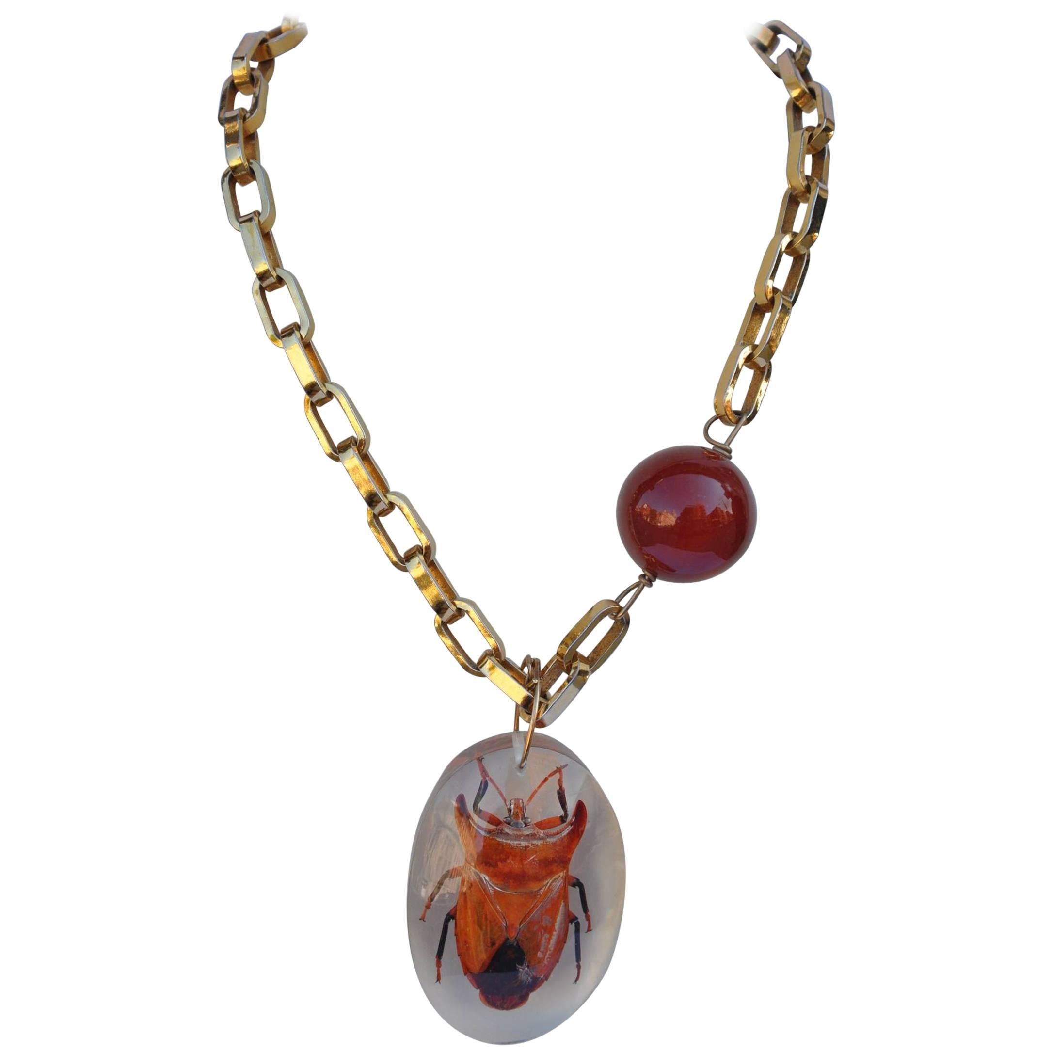 Vendome Thick Link Accented with Amber-Hue Globe and Lucite Bug Pendant For Sale