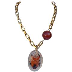 Vendome Thick Link Accented with Amber-Hue Globe and Lucite Bug Pendant