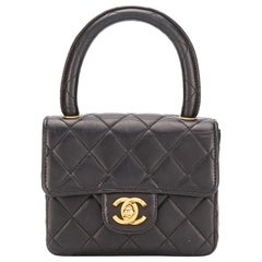 Chanel - Sac à rabat Mini Kelly en cuir noir