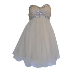 Robe de cocktail diamantée champagne exubérante