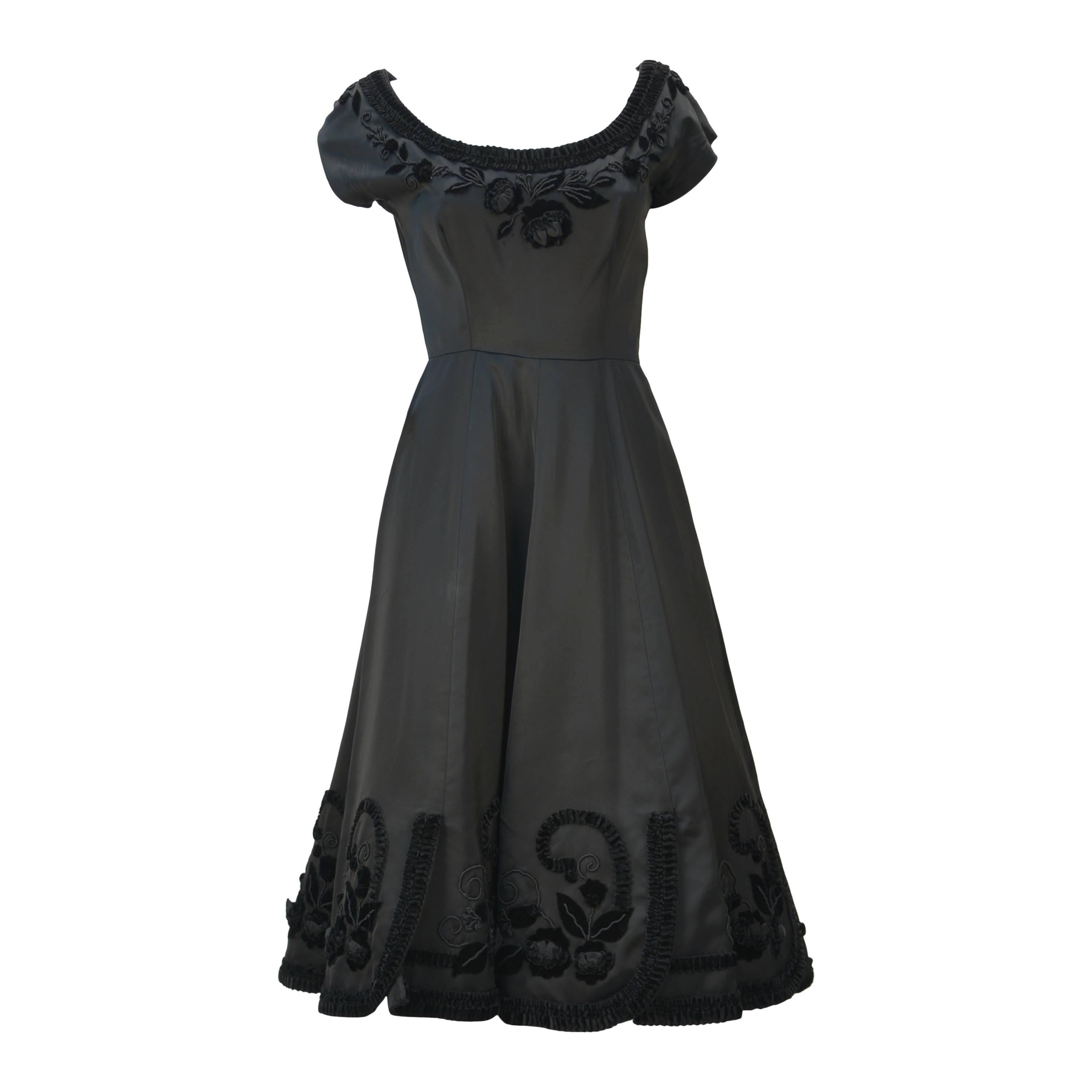 1950s Black Satin Party Dress with Velvet Trim and Floral Detail For Sale