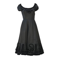 1950s Black Satin Party Dress with Velvet Trim and Floral Detail