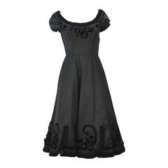 1950s Black Satin Party Dress with Velvet Trim and Floral Detail 9