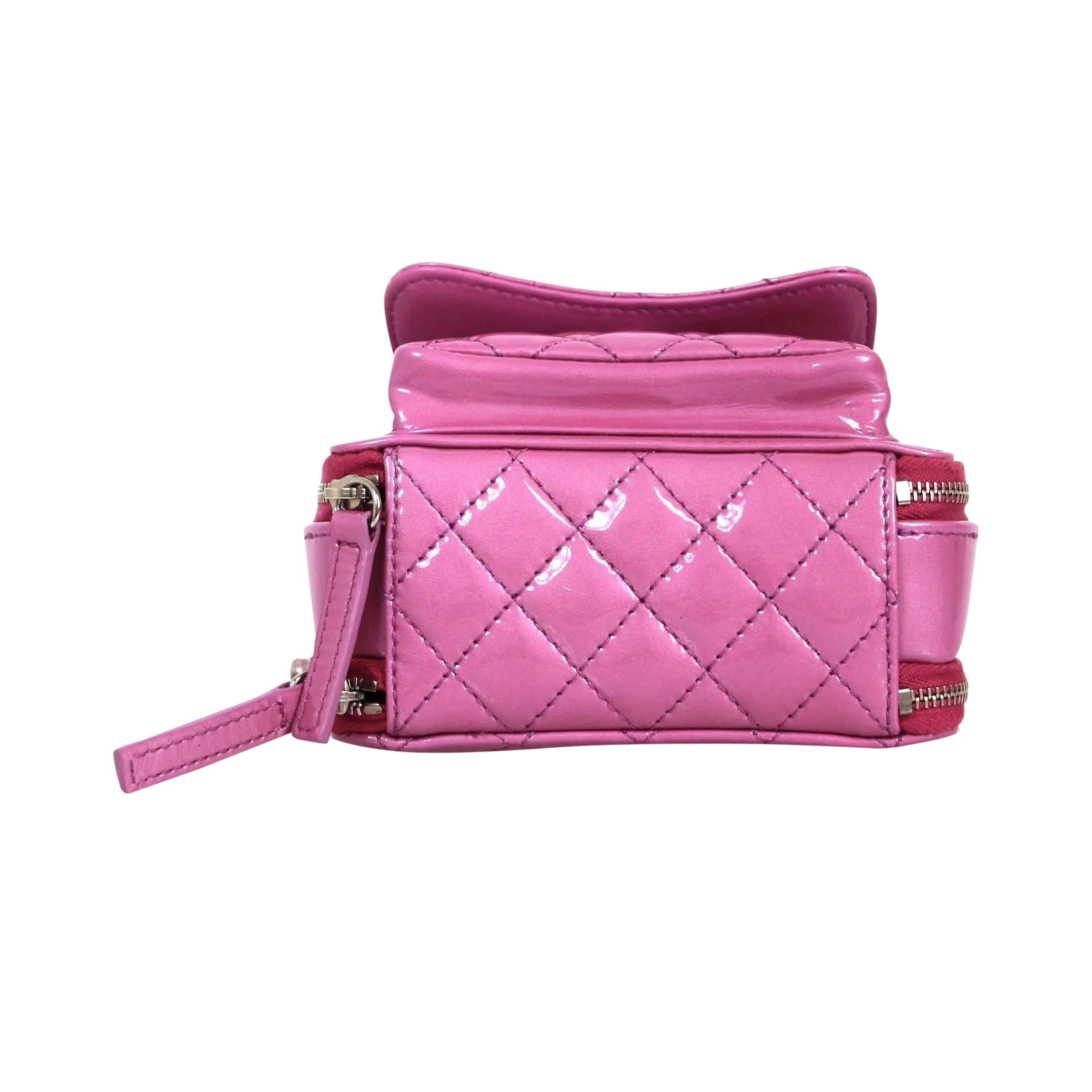 Chanel 2015 Line, rare piece hard to get in stores or online. Gorgeous pastel purple in patent leather with a hint of a pearled effect. Front small compartment, second larger zipper compartment, and third zipper compartment with zipper, lined with