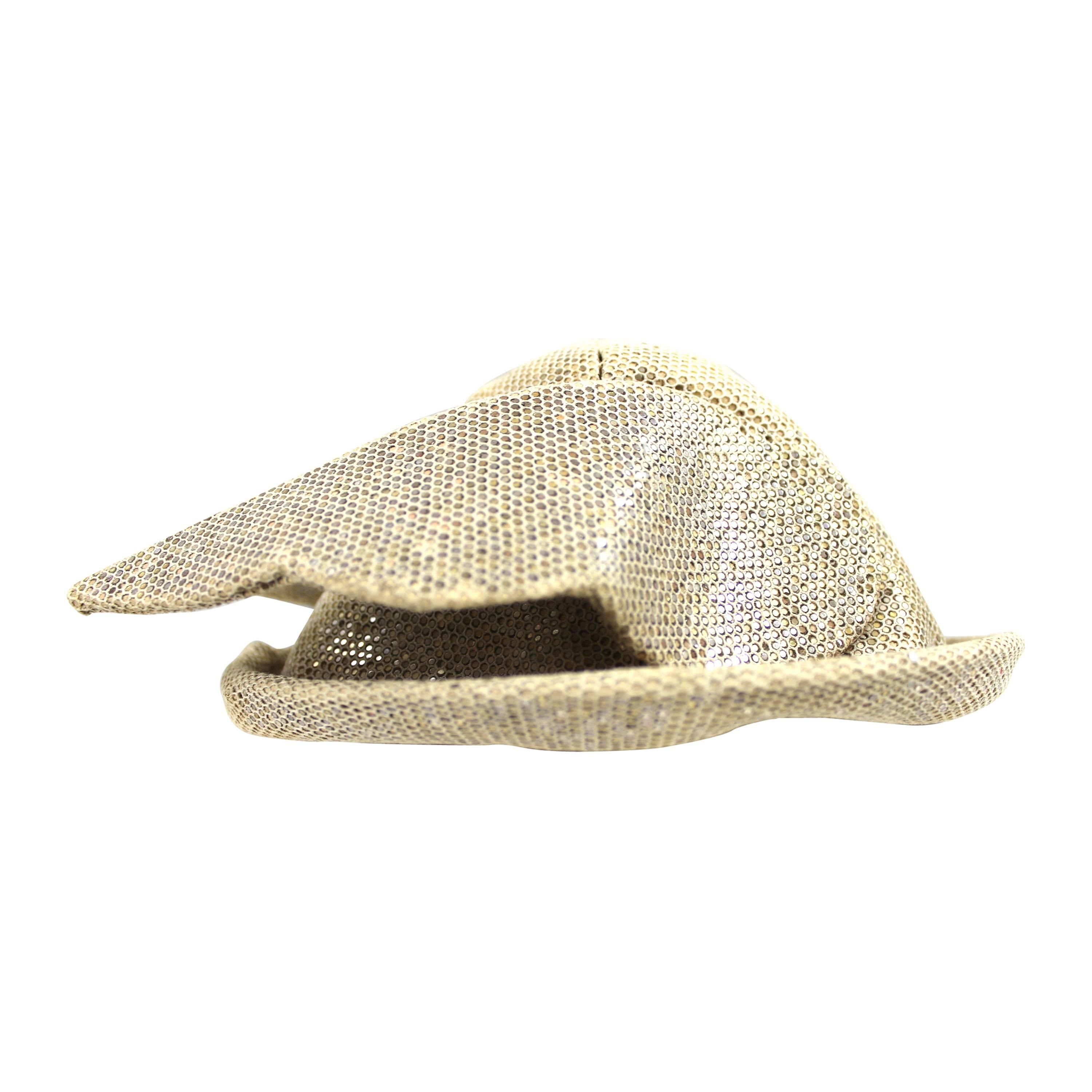 Early vintage Stephen Jones Hermes/Mercury Winged Hat
Constructed in aged looking sequin fabric which makes it look as if it is carved from a form a ancient stone.
A real collectors piece from the beginning of Stephen Jones career that launched