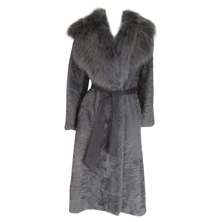 Elegant astrakhan/lamb coat with fox fur collar at 1stDibs