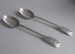 An exceptionally fine and heavy pair of George III Stuffing Spoons