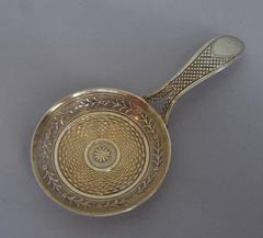 A rare George III Neo-Classical silver gilt "Frying Pan" Caddy Spoon