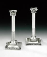 Antique An exceptional and very rare pair of George III Cast "Ionic" Column Candlestick