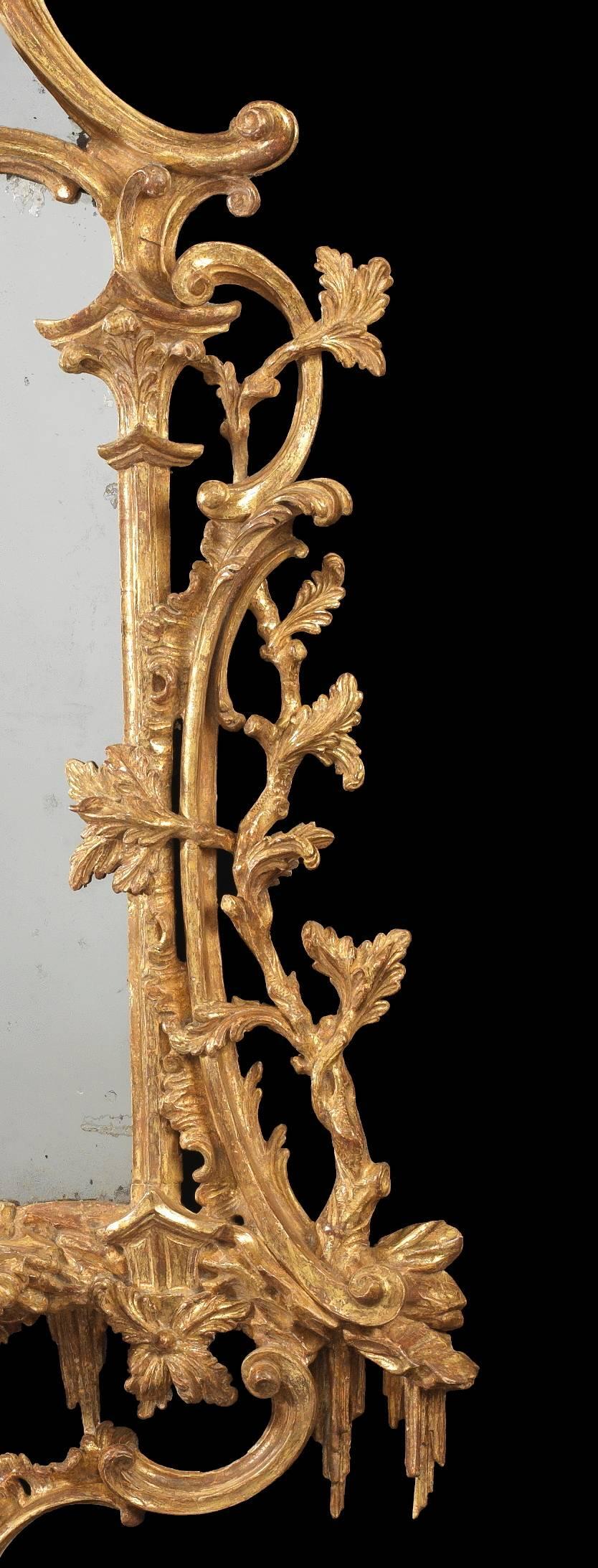 An exceptional George III giltwood girandole attributed to Thomas Chippendale. This girandole is characteristic of the exuberance of English Rococo design found in the work of Thomas Chippendale and Thomas Johnson; a ho-ho bird with outstretched