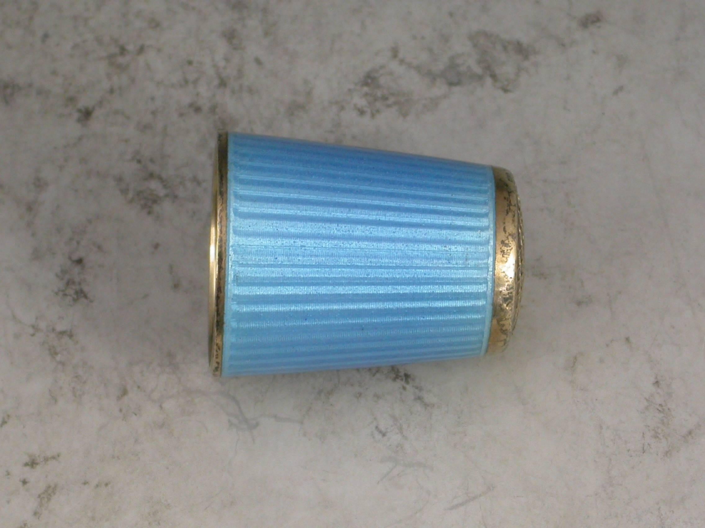 A fine quality early 20th century Norwegian silver gilt and sky blue guilloche enamel thimble. 

By David Anderson, Oslow, Norway, c1920

In good condition with no damage or repair

Length 	22  mm (0.87 inches)
Diameter 	17  mm (0.67 inches)
Weight