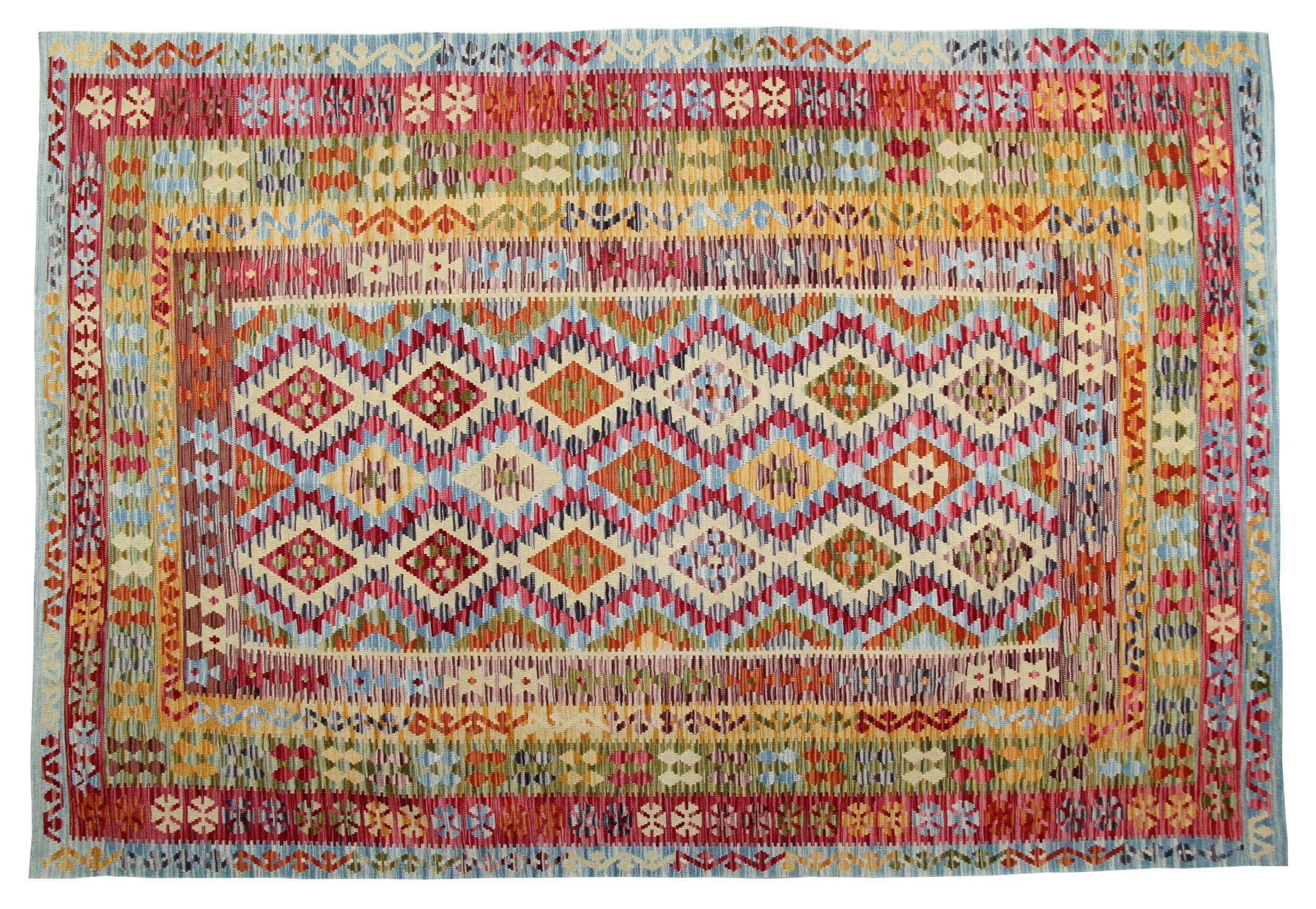 This Kilim is ultimately traditional rugs, but it shows striking modern rugs features and so it has been defined as 'eclectic'. The colors are psychedelic: fuchsia, orange, yellow, red and cadet blue. However, the design is traditional and