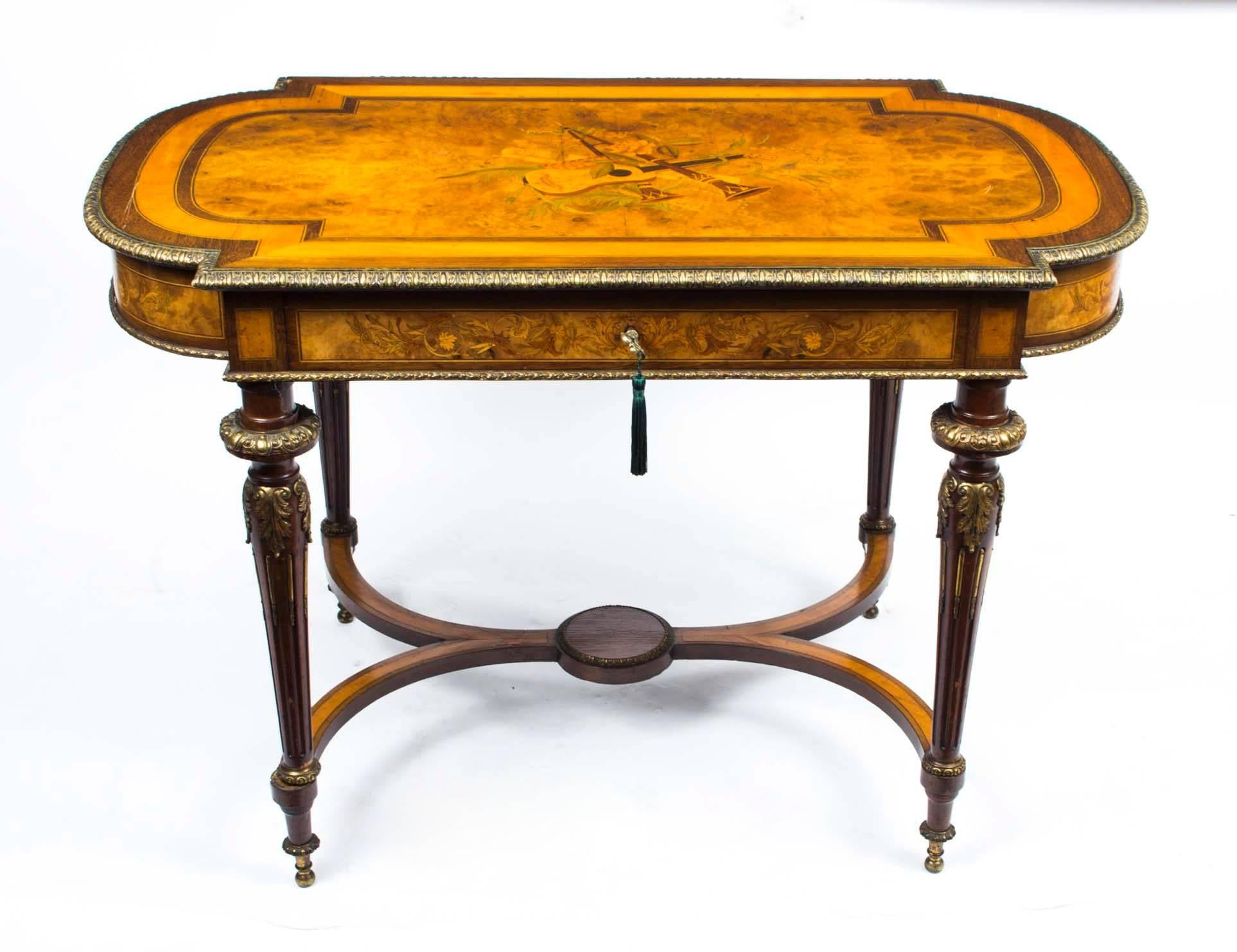 This is a gorgeous antique French ormolu mounted marquetry rosewood and burr walnut bureau plat or centre table, circa 1860 in date. 

This fabulous table features beautiful marquetry decoration in kingwood and purple heart with elegant ormolu