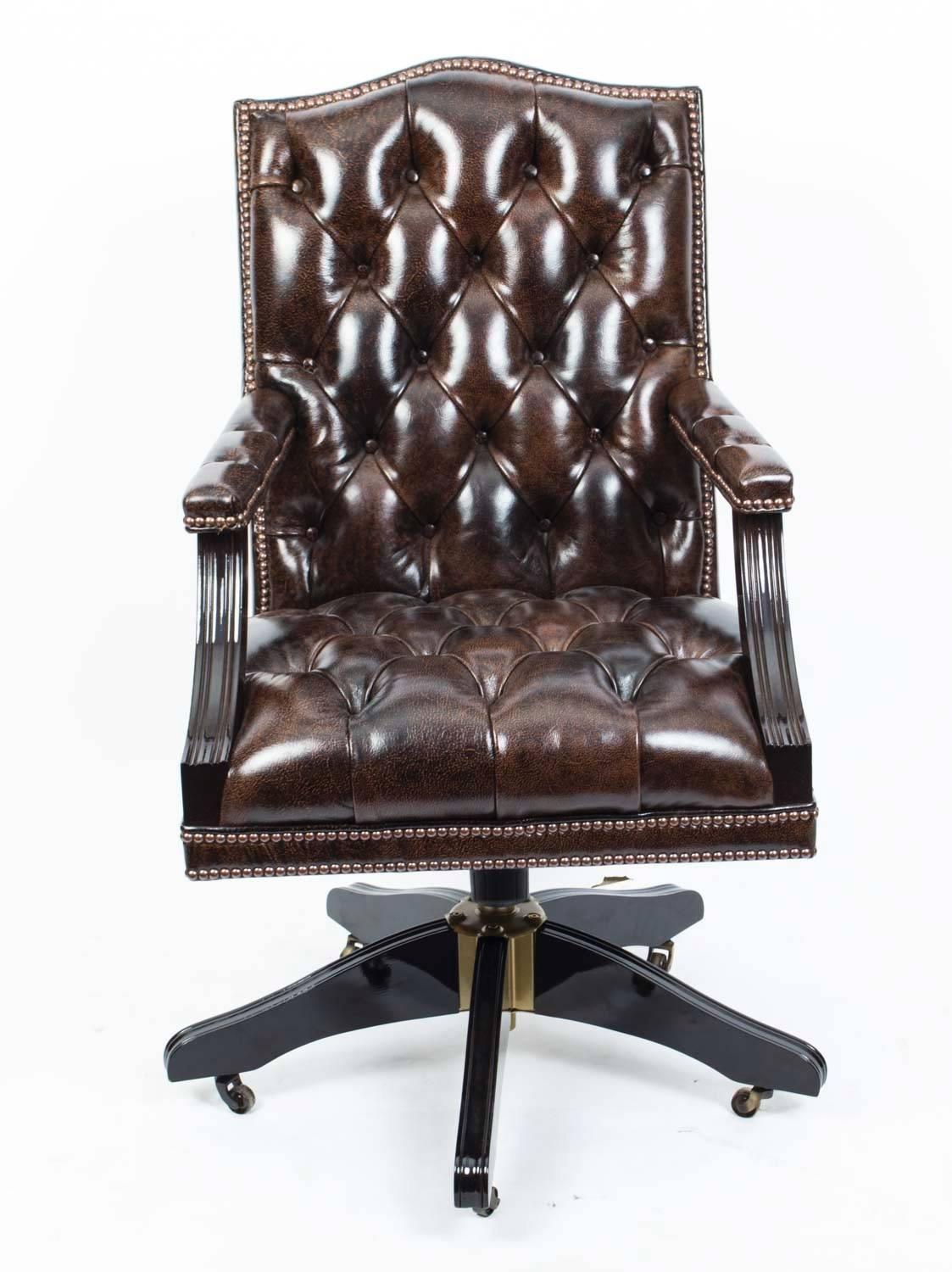 This is an absolutely stunning leather 'Gainsborough chair' hand-made in England with materials of the finest quality. 

It is upholstered in very decorative top quality Italian designer cow hide and the studding is achieved with close individual