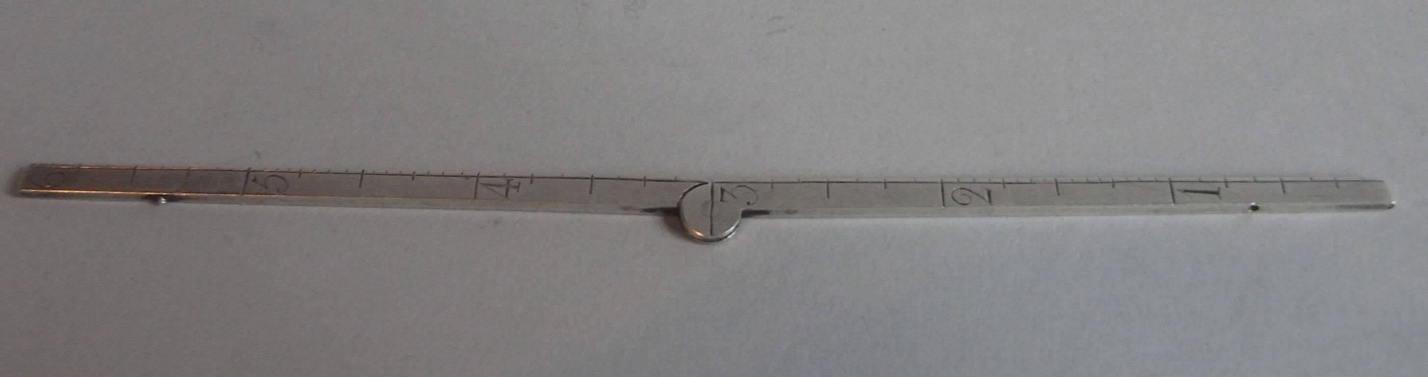 This rare folding ruler is beautifully engraved for six inches on both sides. A very rare survivor. 

Length: 6 inches, 15cm