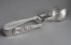 A highly important pair of George III cast Britannia Standard Serving Tongs made