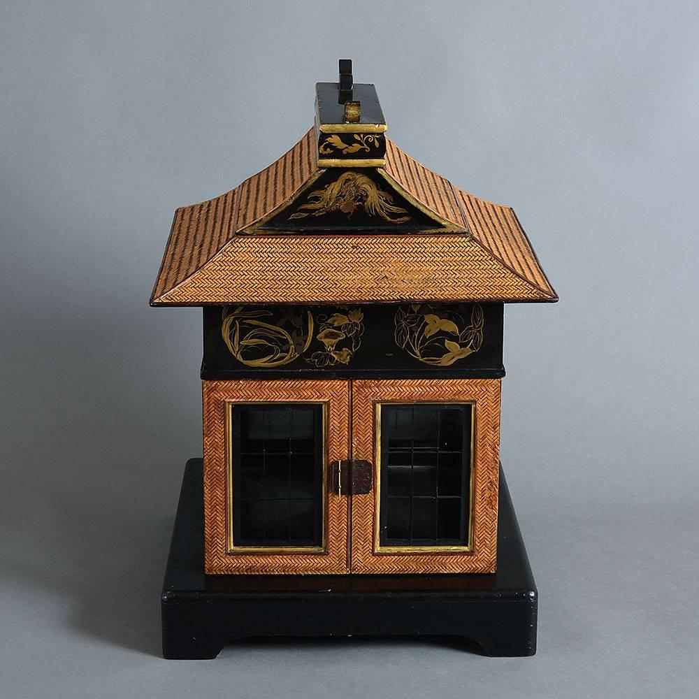 An exceptionally fine late 19th century picnic box in the form of a pagoda, the roof and walls disassembling as compartments, all modelled using gilded lacquer and woven bamboo.