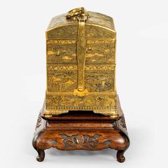 A superb and rare gold inlaid iron jubako (lunch box) by Komai of Kyoto