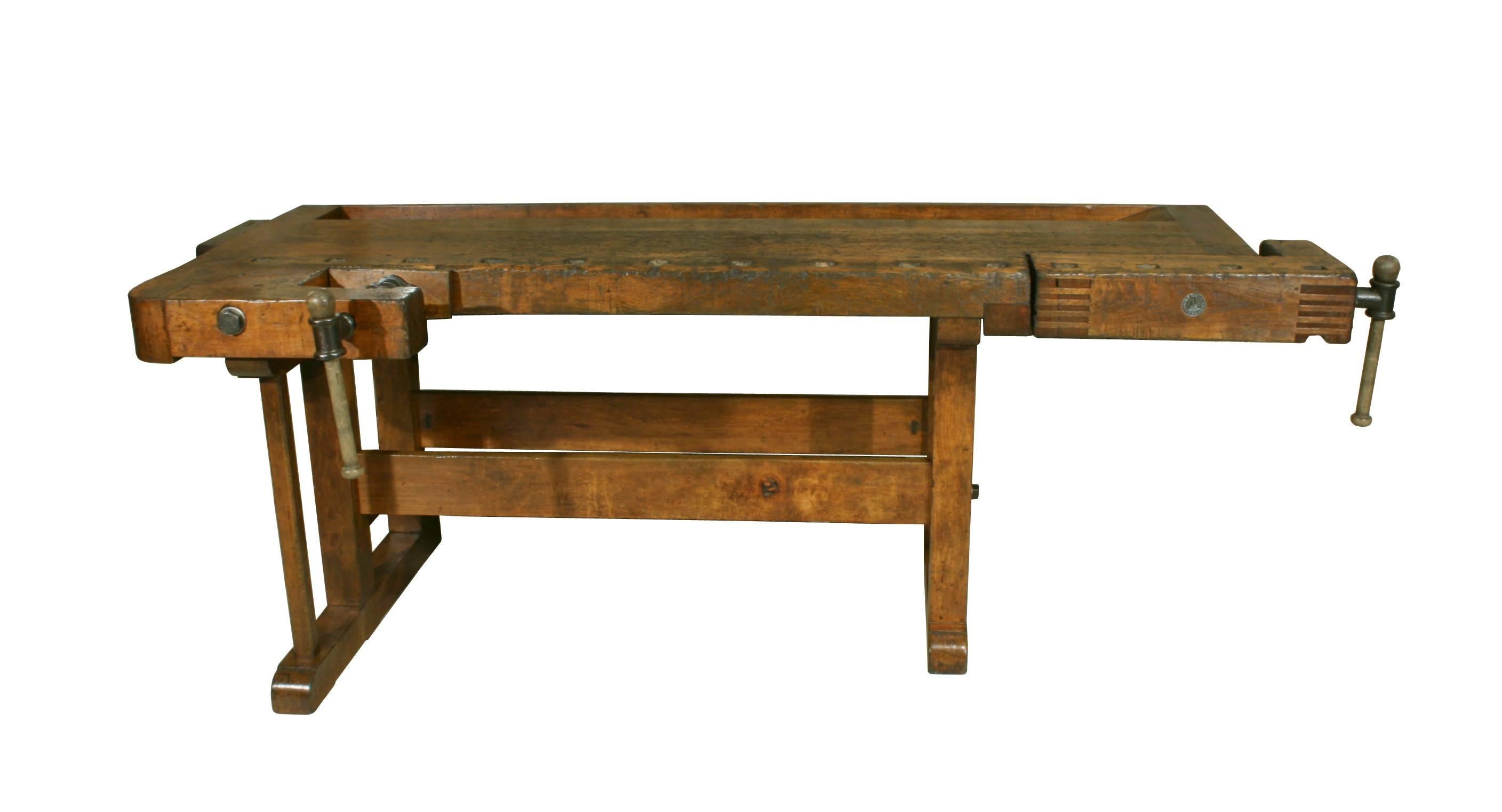 Antique Continental Carpenter’s Workbench. 
A wonderful large work bench with solid beech wood top and beech legs with a good warm rich patina. The bench has two vices, one on the front edge and the other on the right hand side. The top leading