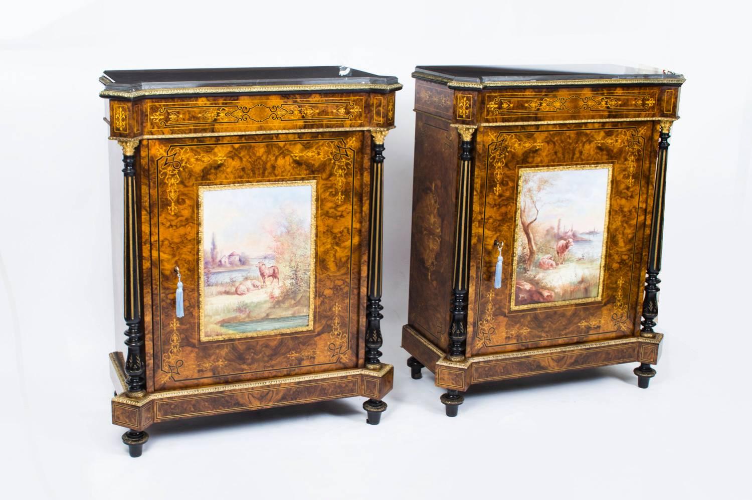 This is a superb pair of Victorian ormolu and porcelain mounted burr walnut and inlaid pier cabinets. 

Each with a dark grey marble top above a door mounted with a hand painted French Sevres style porcelain plaque depicting two lost sheep in a