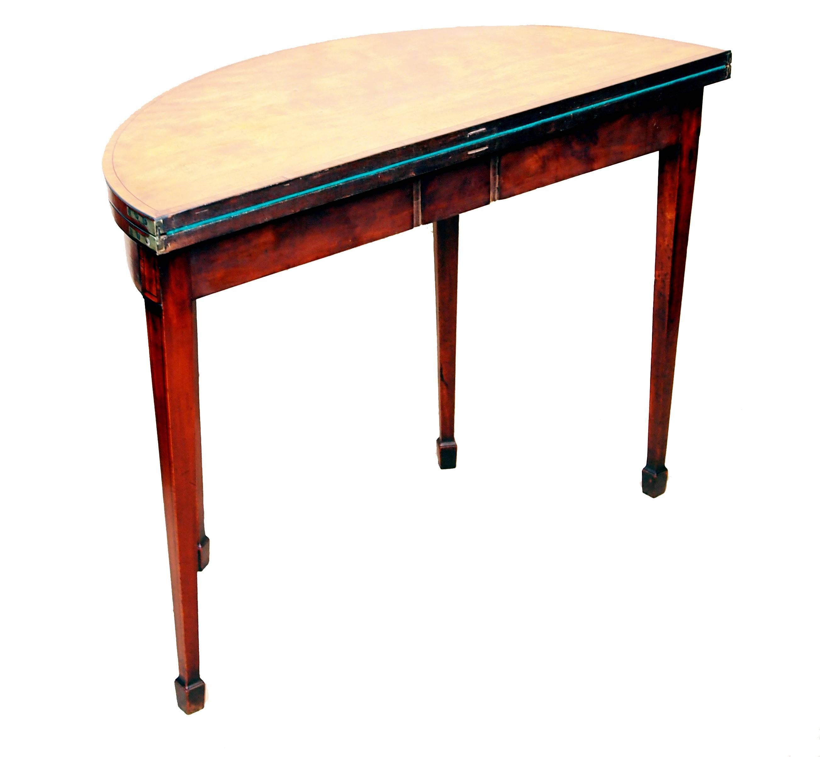 A fine quality George III period satinwood demilune shaped card.
Table having superbly figured folding top with tulipwood crossbanded
 decoration above banded frieze raised on elegant
square tapered legs terminating on spade feet.
