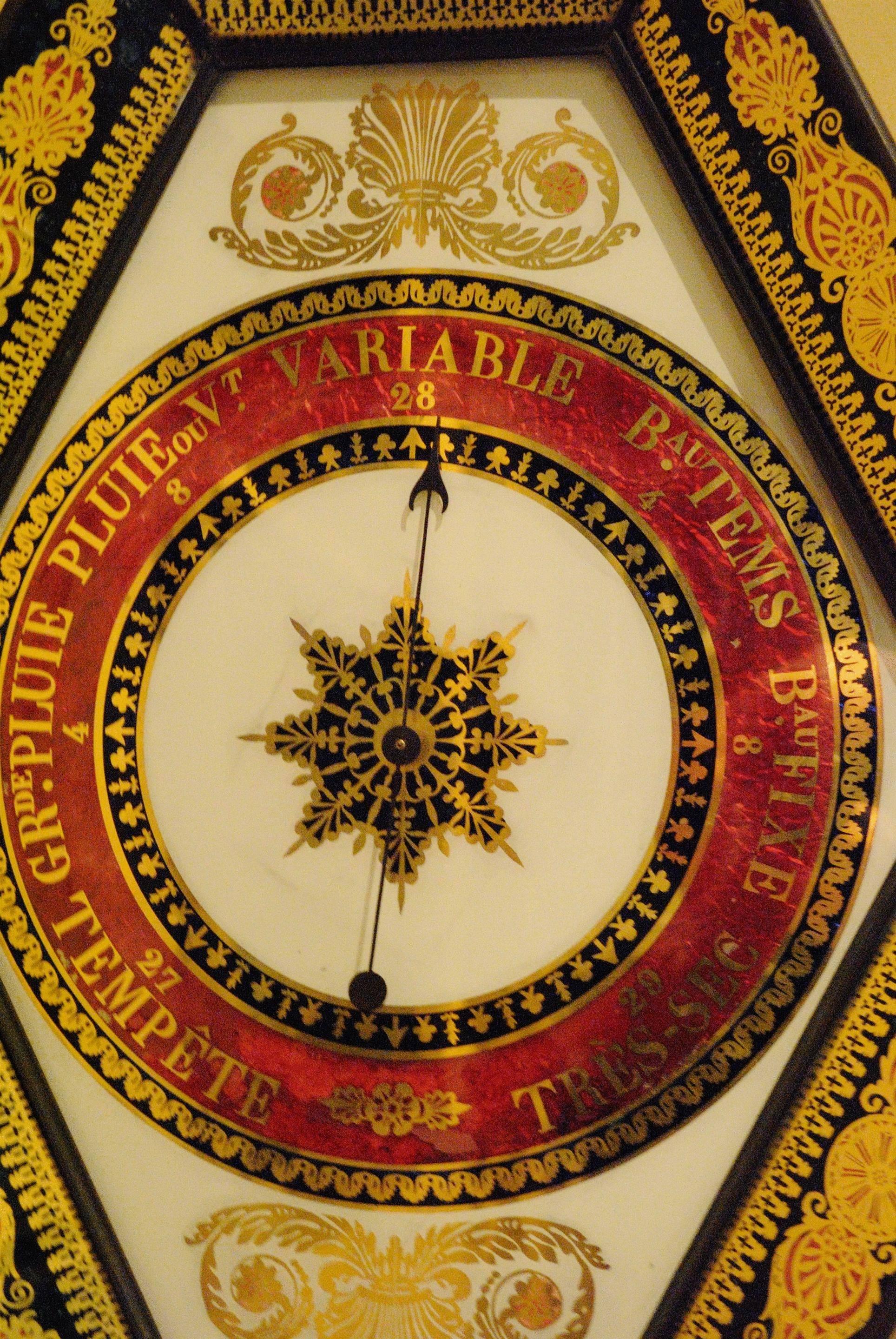 A fine decorative french eglomise barometer.