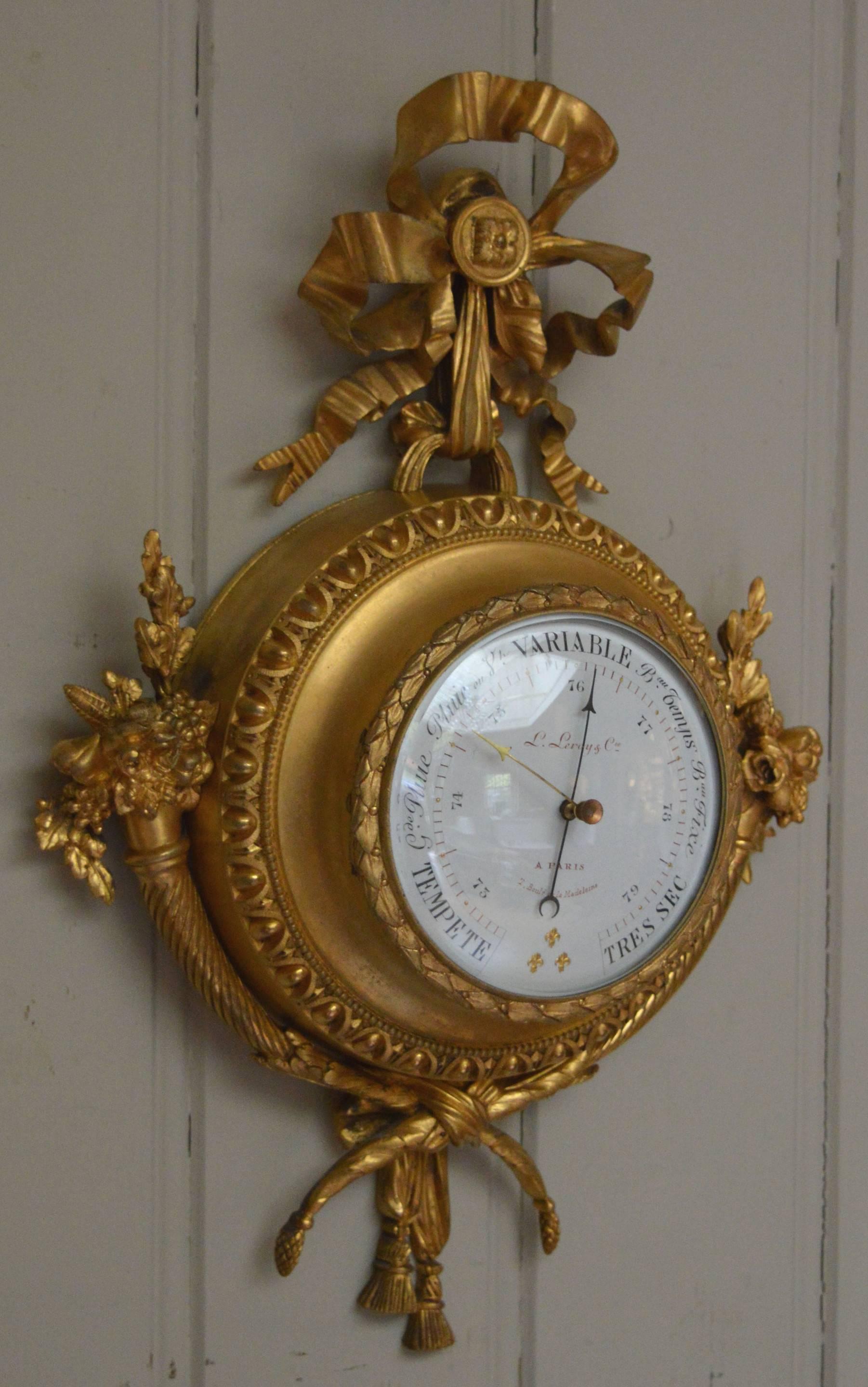 A very unusual late 19th Century aneroid barometer. It has a Louis XVI style case embossed with swags and floral garlands and ribbons. It has a high dome glass and an enamel dial signed by th maker L. Le Roy of Paris.