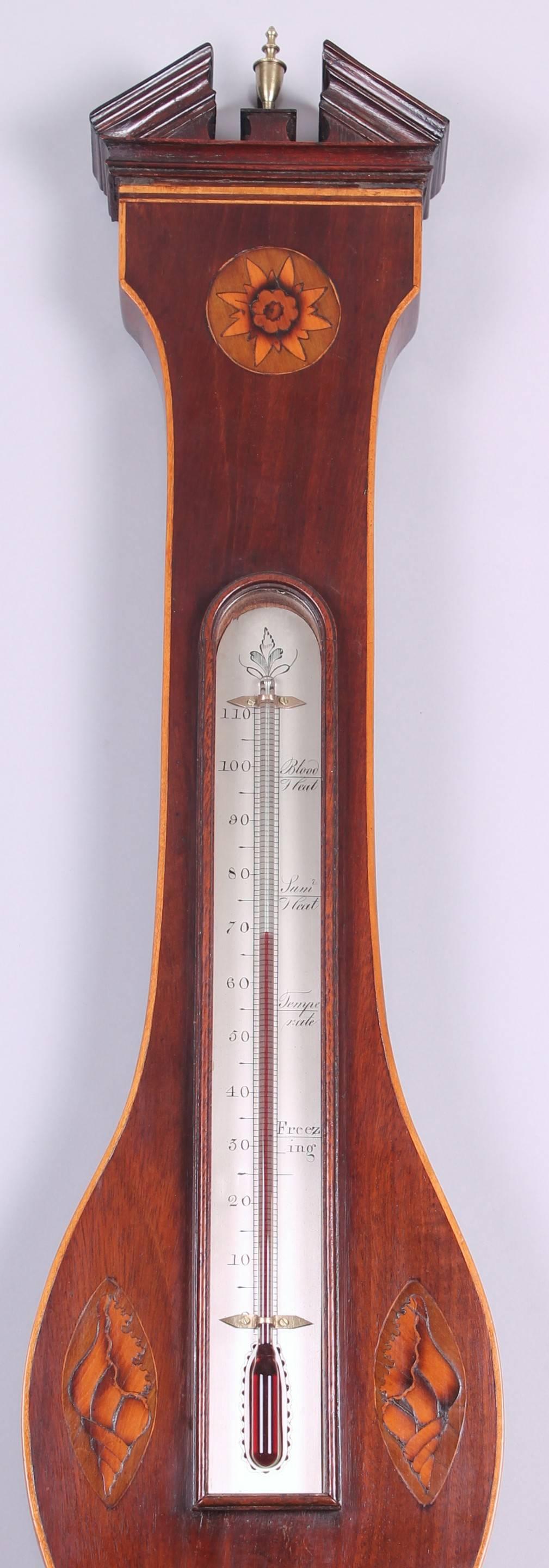 Early nineteenth century mahogany wheel barometer by F Salteri & Co, Nottingham. The case decorated in the Sheraton style with inlaid paterae and stylised sea-shells. 
Salteri & Co are known to have been working in Nottingham from 1810 to 1835