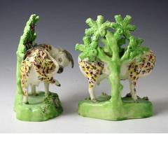 Staffordshire Pottery Figures of Cows on Bases with Bocage Pearlware Glaze