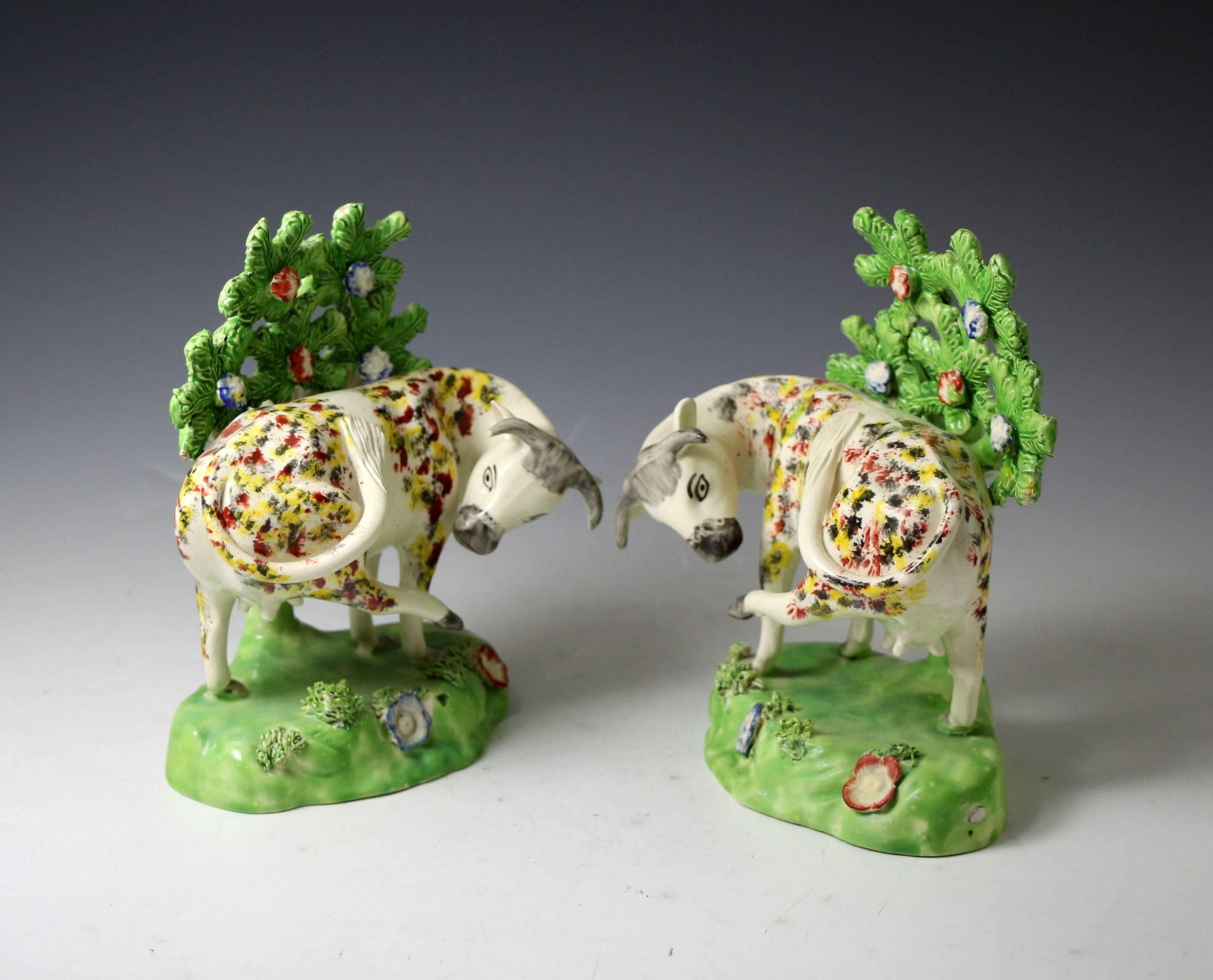 English Staffordshire Pottery Figures of Cows on Bases with Bocage Pearlware Glaze For Sale