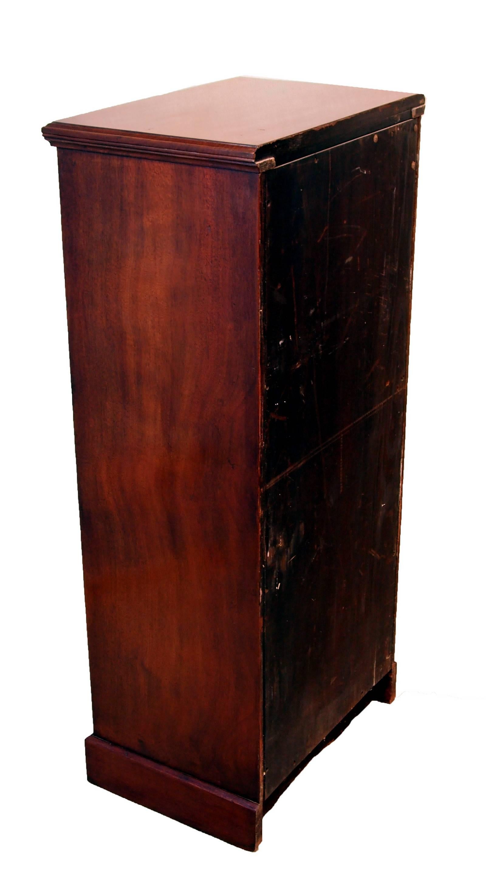 An excellent quality late 19th century mahogany pedestal chest of six drawers retaining original brass ring drop handles raised on original plinth.