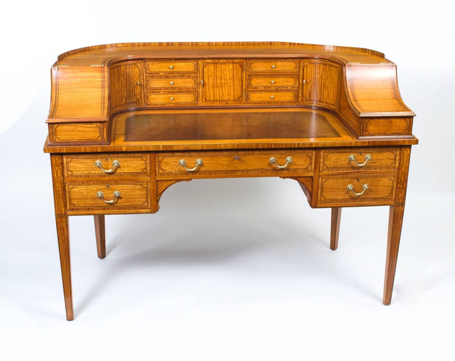 This is a beautiful antique late Victorian satinwood Carlton House Desk, circa 1880 in date. 

This beautiful desk is made from satinwood, which has been crossbanded in Kingwood and has superb ebony line inlaid decoration. It is superbly finished