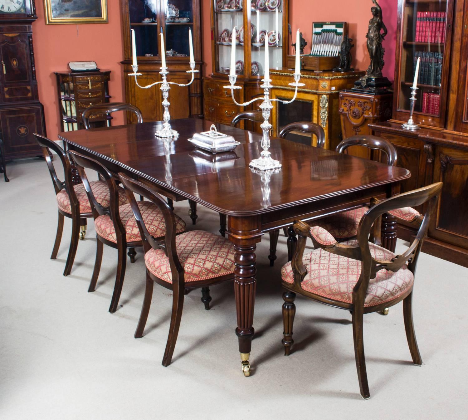 A very rare opportunity to own an antique English Regency dining room table in the manner of Gillows, Circa 1820 in date, with a set of eight vintage balloon back dining chairs. 

This amazing table has two original leaves, can sit eight people in