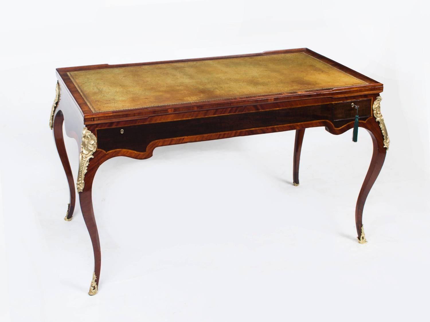 This is a lovely antique French burr walnut and ebonised tric-trac table, circa 1860 in date. 

The card table stands on elegant slender cabriole legs, is further decorated with gilded ormolu mounts and it has two useful drawers for storing chess