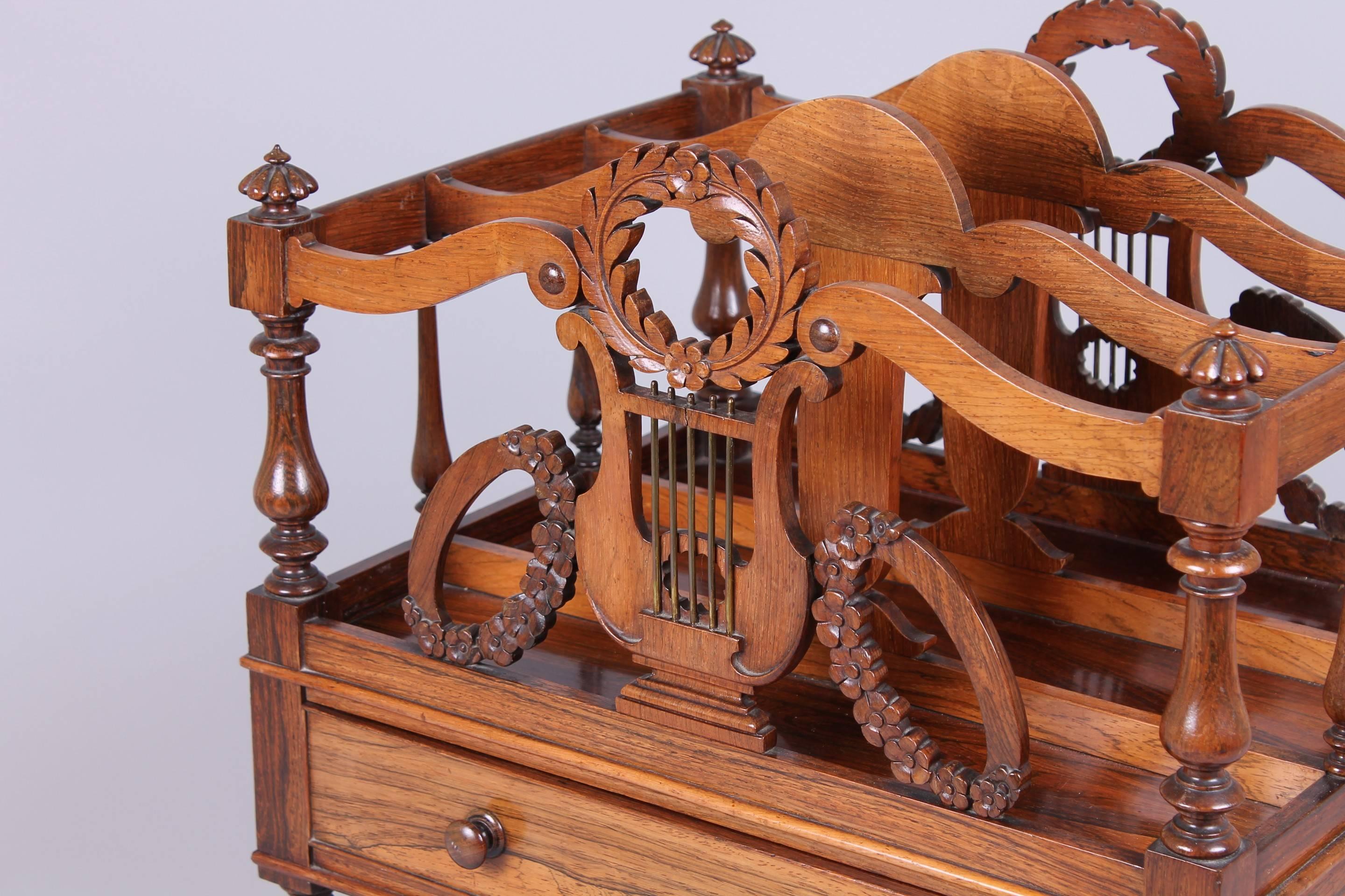 George IV period rosewood Canterbury in the manner of Gillows of Lancaster with brass-strung lyre-shaped facings,

circa 1825.