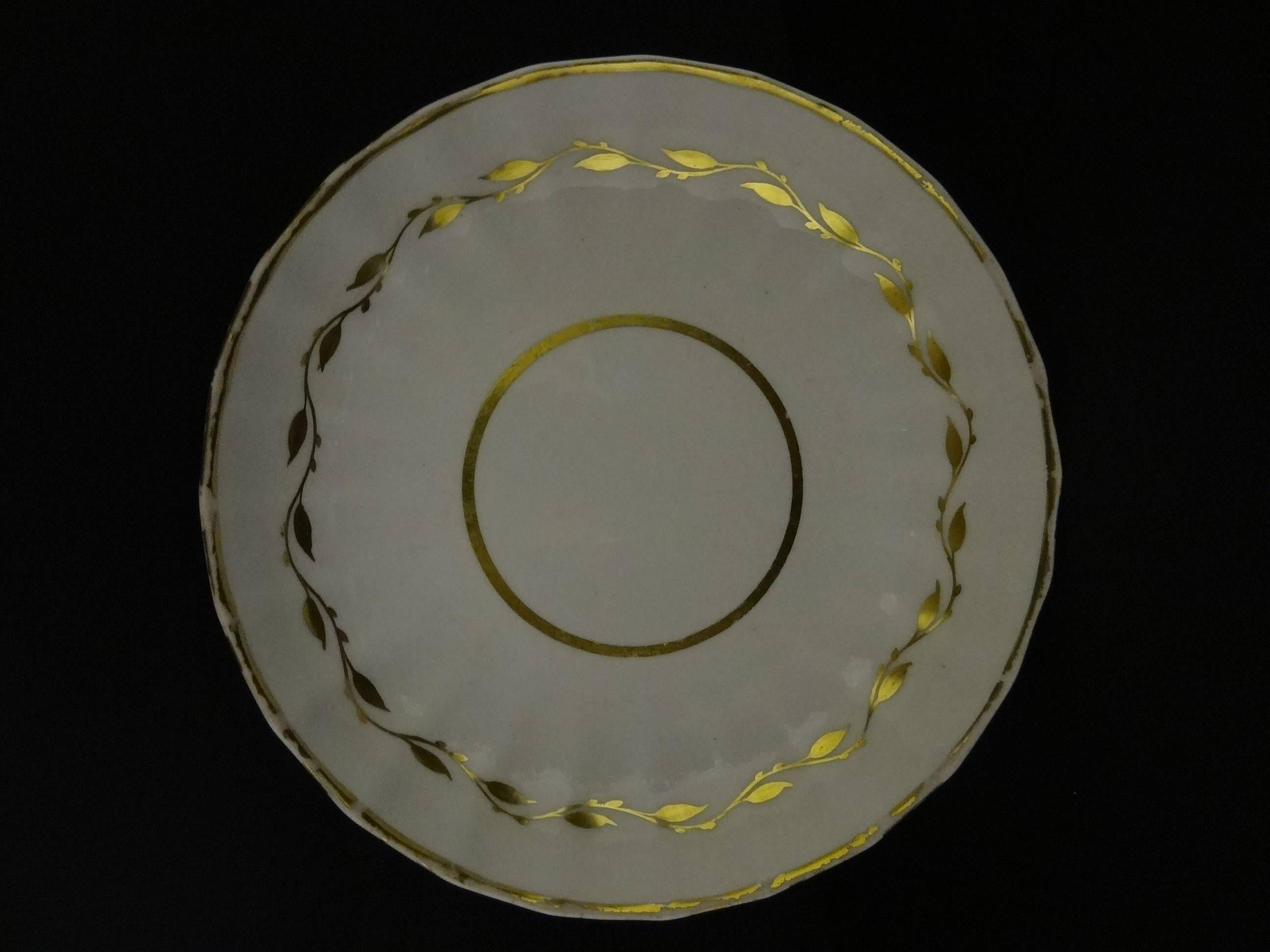 A ribbed derby cup and saucer.

Cup: h 6.40 cm, d 7.60 cm. 

Saucer: h 2.90 cm, d 14.30 cm.