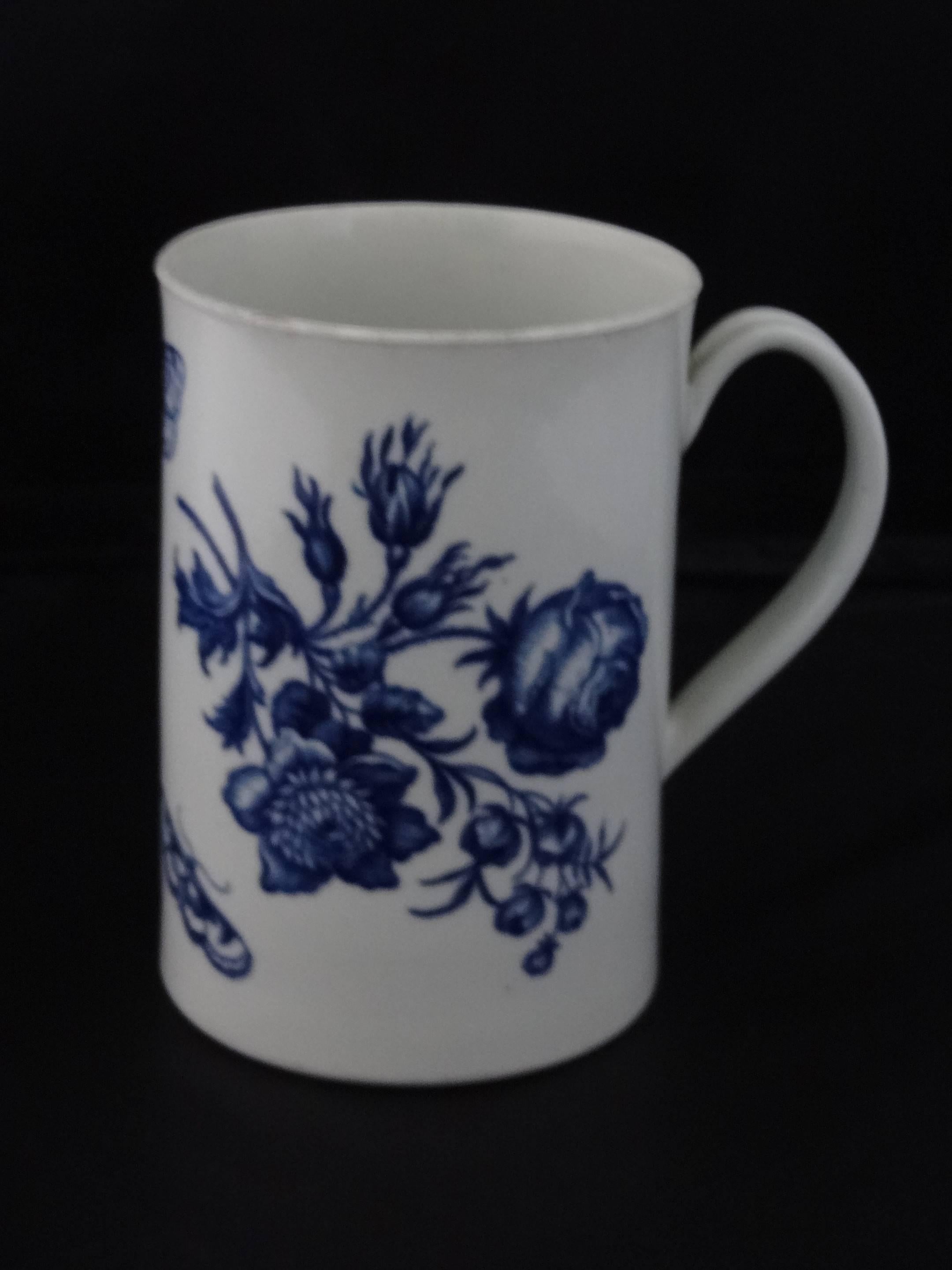 A lovely Worcester blue and white decorated cylindrical mug.