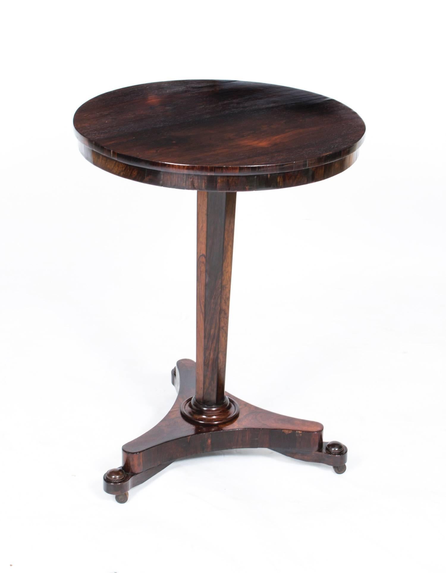 This elegantly proportioned antique Regency occasional table, is circa 1820 in date. 

This table has been masterfully crafted in rosewood, with a circular top on a octagonal tapering column with a triform base. 

There is no mistaking the