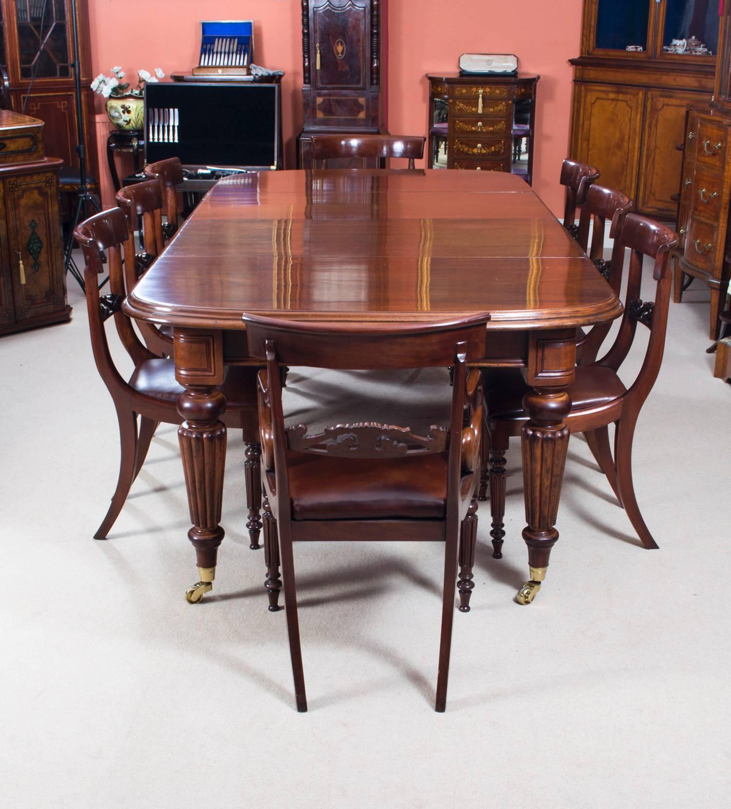 This is a beautiful antique dining set comprising a Victorian D-end mahogany dining table, circa 1850 in date, and a set of eight English antique Regency dining chairs, circa 1820 in date. 

This amazing table has two original leaves, can sit